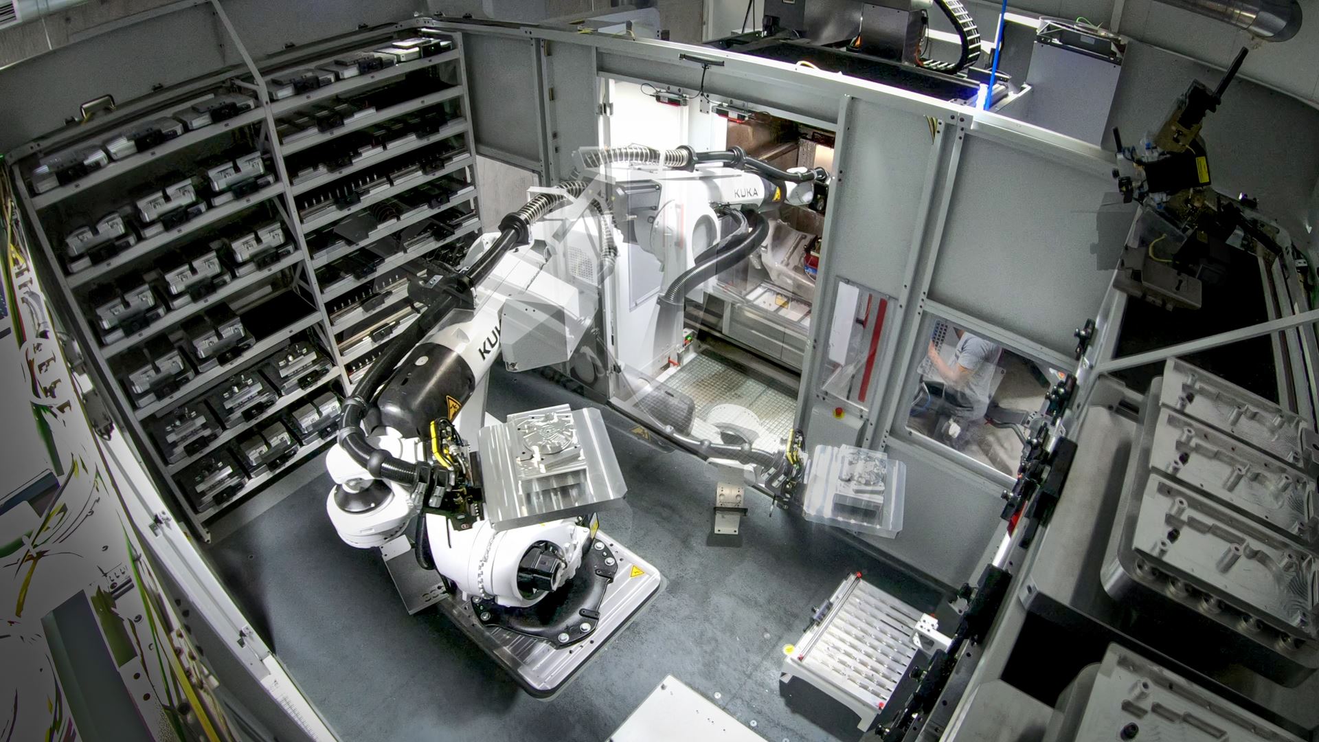 KUKA robot loading parts in automated machining cell