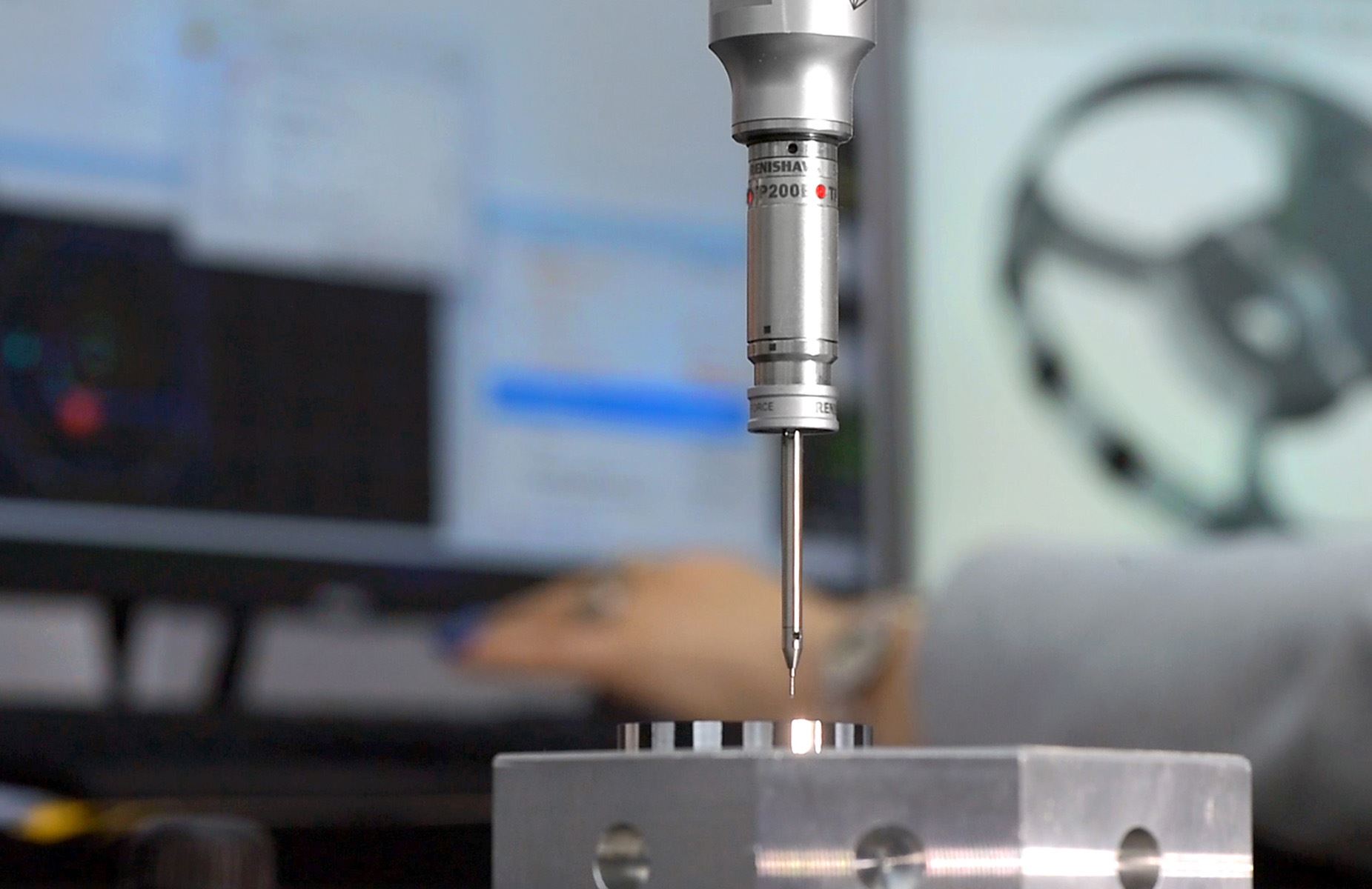 Touch probe measuring a machined part on fixture