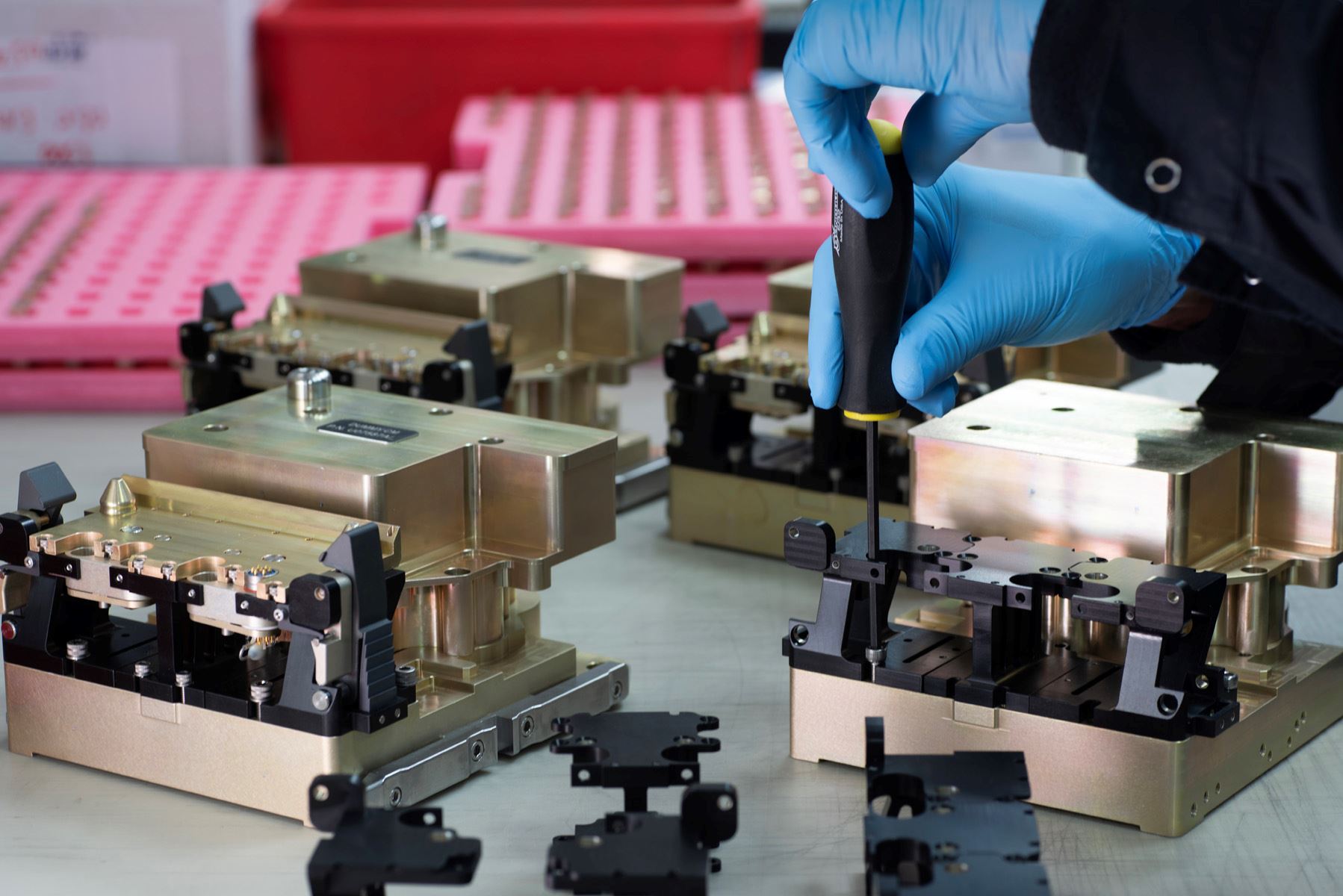 Technician assembling precision tooling fixtures with hand tools