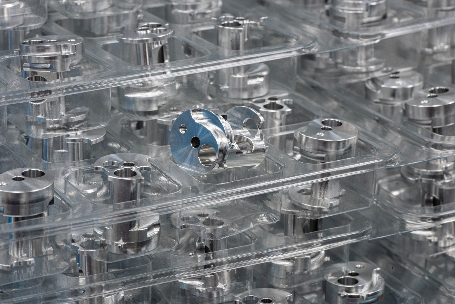 Trays of small machined parts packed for delivery