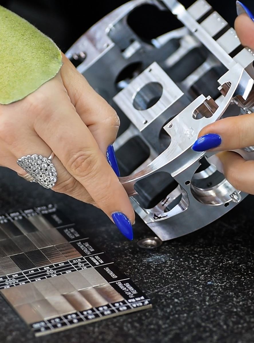 Machined component compared to a surface roughness standard