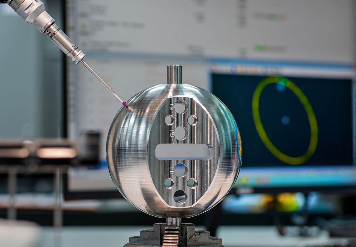 Probe measuring a round part against its scan model
