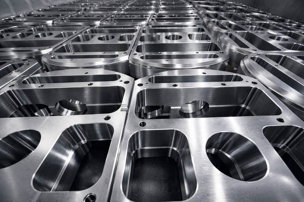 Rows of identical machined plates from a production run