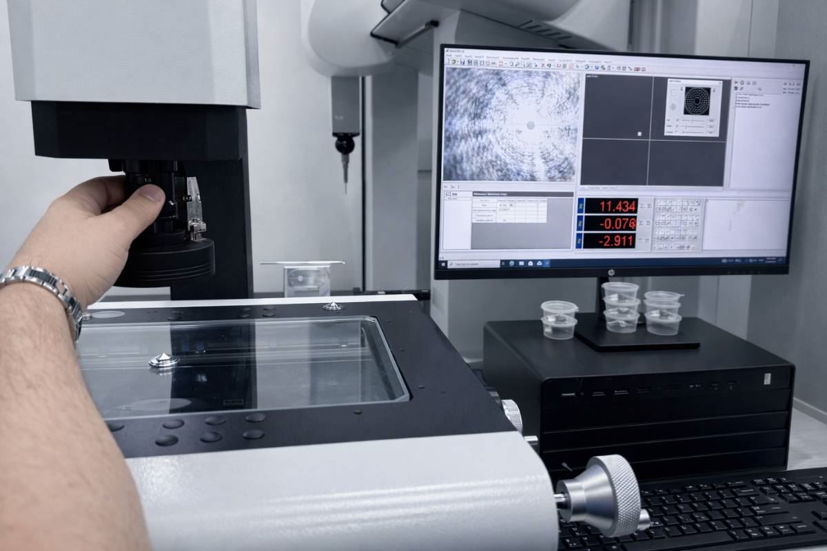 Operator reading dimensional results on optical measuring system