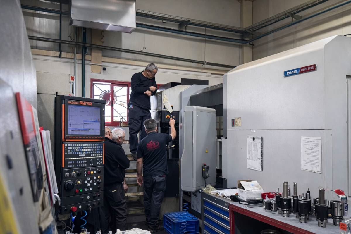 Production team setting up a horizontal CNC machining centre