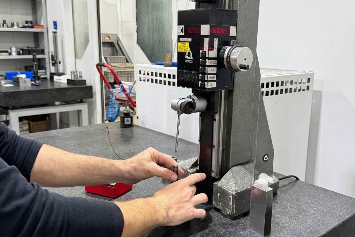 Height gauge measuring a component on granite table