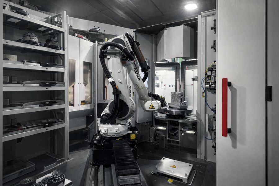 KUKA robot serving a machine tool in automation cell